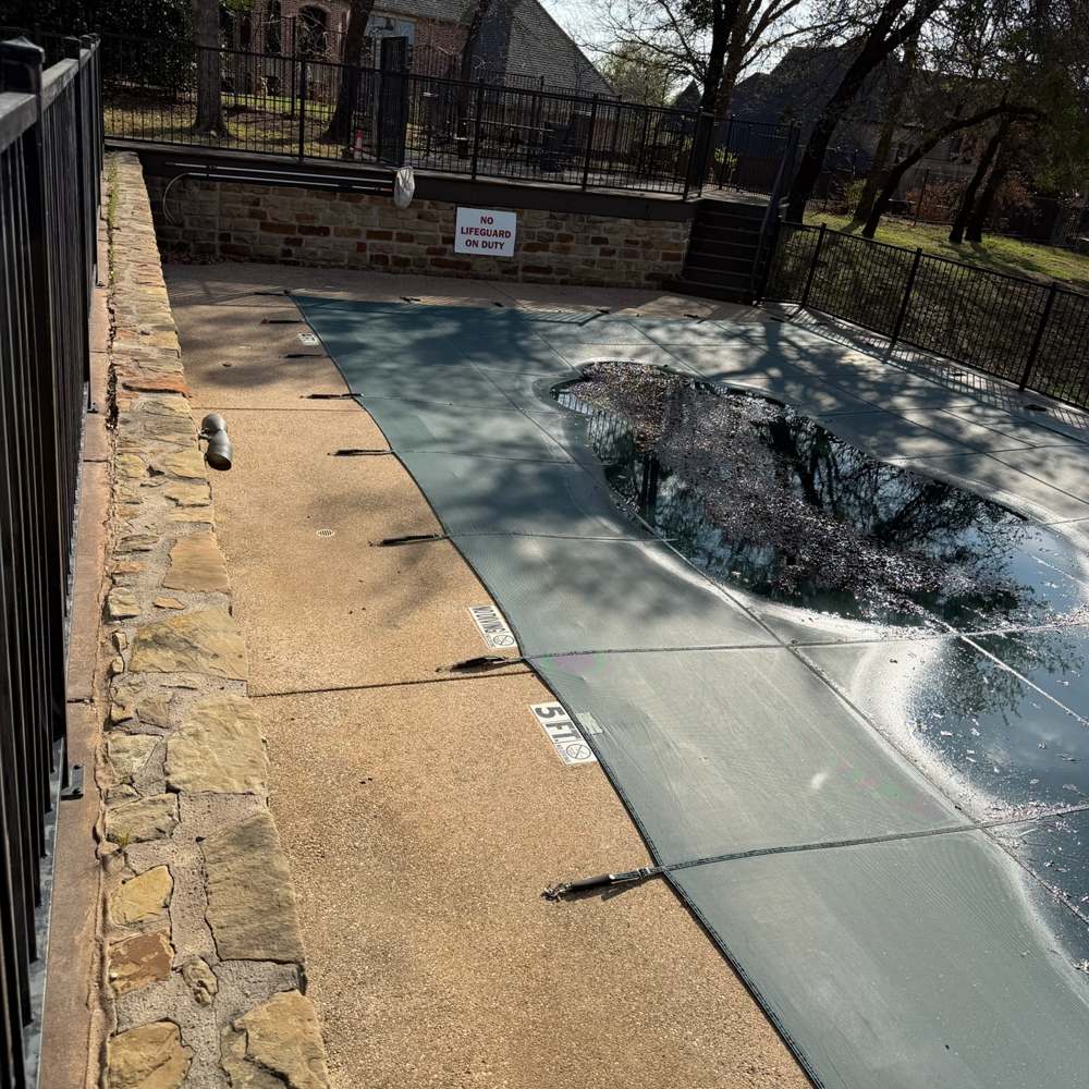 Pool deck concrete brightened by pressure washing